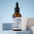 An amber glass dropper bottle of Dual Relief™ Drops Extra Strength, displayed on light blue geometric blocks against a soft blue gradient background.